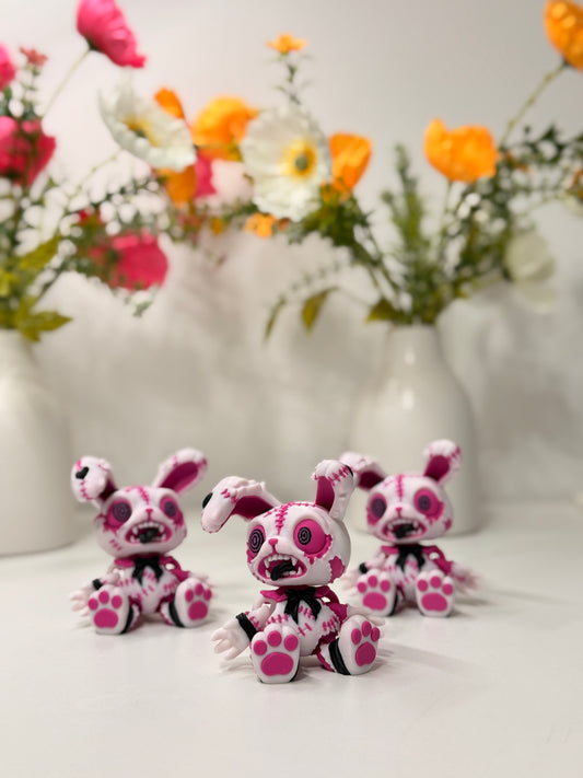 Rosa gestickte Hasenfigur