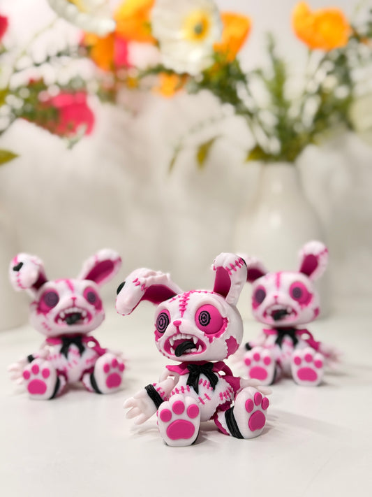 Rosa gestickte Hasenfigur